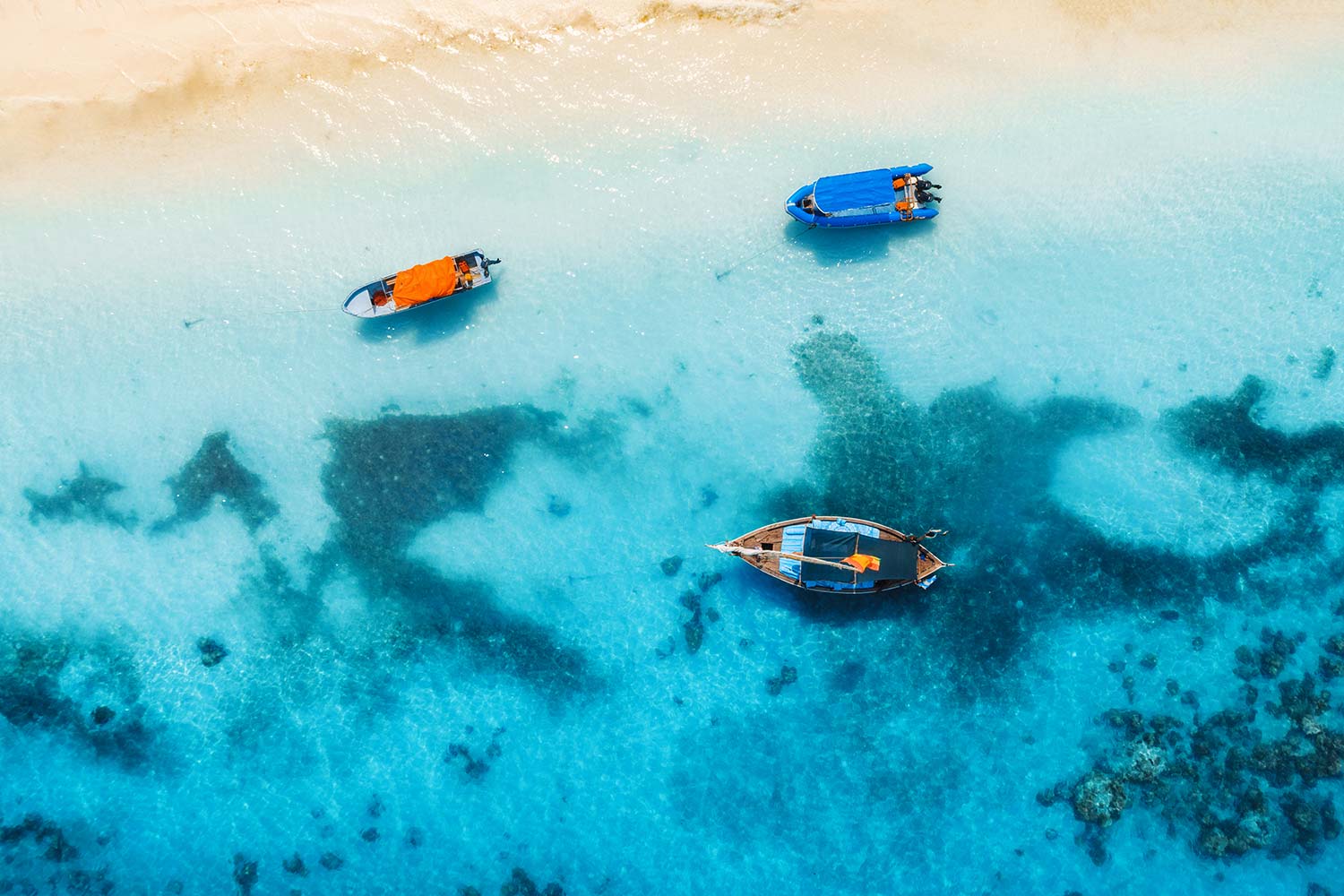 aerial-view-of-the-fishing-boats-in-clear-blue-resize.jpg