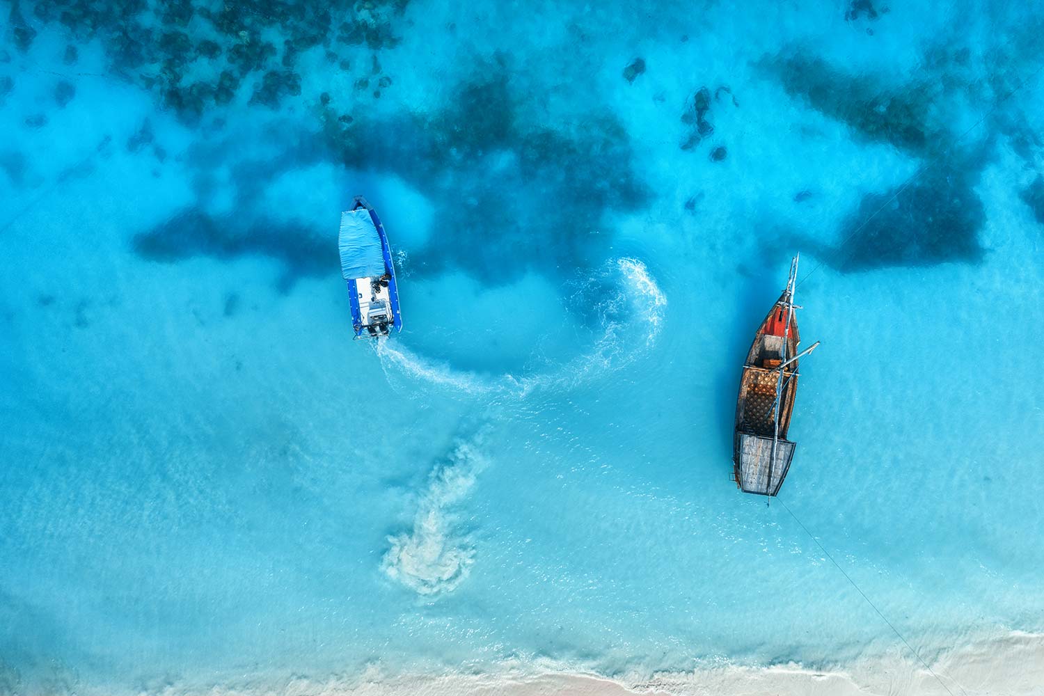 aerial-view-of-the-fishing-boats-in-clear-blue-wat-resize.jpg