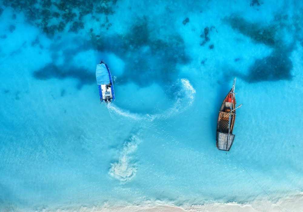 aerial-view-of-the-fishing-boats-in-clear-blue-wat-resize.jpg